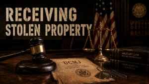 UCMJ Article 122a receiving stolen property hero image with a gavel and military dog tags on a UCMJ document